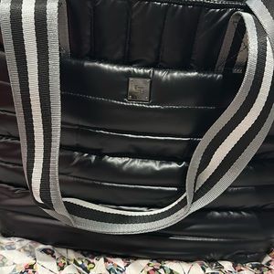 Black Think Rolyn bag. Can be used as a messenger bag. Good space.